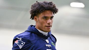 Jun 10, 2025; Foxborough, MA, USA; New England Patriots cornerback Christian Gonzalez (0) jogs to the sideline during minicamp held in the WIN Field House at Gillette Stadium. Mandatory Credit: Eric Canha-Imagn Images