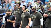 Nov 9, 2025; Charlotte, North Carolina, USA; Carolina Panthers head coach Dave Canales and coaching staff on the sidelines in the third quarter at Bank of America Stadium. Mandatory Credit: Bob Donnan-Imagn Images