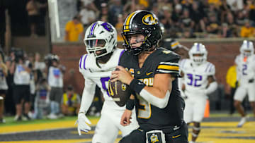 Aug 28, 2025; Columbia, Missouri, USA; Missouri Tigers quarterback Beau Pribula (9) runs in for a touchdown against the Central Arkansas Bears during the second half of the game at Faurot Field at Memorial Stadium. Mandatory Credit: Denny Medley-Imagn Images