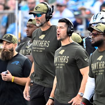 Nov 9, 2025; Charlotte, North Carolina, USA; Carolina Panthers head coach Dave Canales and coaching staff on the sidelines in the third quarter at Bank of America Stadium. Mandatory Credit: Bob Donnan-Imagn Images