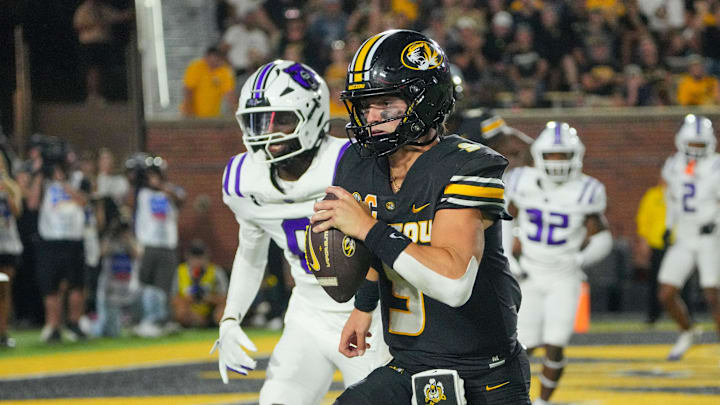Aug 28, 2025; Columbia, Missouri, USA; Missouri Tigers quarterback Beau Pribula (9) runs in for a touchdown against the Central Arkansas Bears during the second half of the game at Faurot Field at Memorial Stadium. Mandatory Credit: Denny Medley-Imagn Images