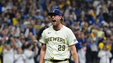 Oct 13, 2025; Milwaukee, Wisconsin, USA; Milwaukee Brewers relief pitcher Trevor Megill (29) reacts after a strikeout to end the eighth inning against the Los Angeles Dodgers during game one of the NLCS round for the 2025 MLB playoffs at American Family Field. Mandatory Credit: Benny Sieu-Imagn Images