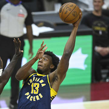 Oct 10, 2024; Cleveland, Ohio, USA; Indiana Pacers center James Wiseman (13) shoots beside Cleveland Cavaliers forward JT Thor (15) in the fourth quarter at Rocket Mortgage FieldHouse. Mandatory Credit: David Richard-Imagn Images