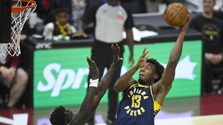 Oct 10, 2024; Cleveland, Ohio, USA; Indiana Pacers center James Wiseman (13) shoots beside Cleveland Cavaliers forward JT Thor (15) in the fourth quarter at Rocket Mortgage FieldHouse. Mandatory Credit: David Richard-Imagn Images