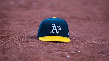 May 26, 2022; Oakland, California, USA; Oakland Athletics baseball hat on the field of play during the third inning after the called third strike of Oakland Athletics designated hitter Jed Lowrie (not pictured) at RingCentral Coliseum. Mandatory Credit: Neville E. Guard-Imagn Images