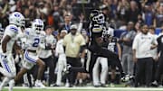 Dec 28, 2024; San Antonio, TX, USA; Colorado Buffaloes wide receiver Travis Hunter (12) runs with the ball during the second quarter against the Brigham Young Cougars at Alamodome. Mandatory Credit: Troy Taormina-Imagn Images