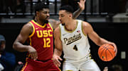 Purdue Boilermakers forward Trey Kaufman-Renn (4) leans into USC Trojans forward Rashaun Agee (12) 