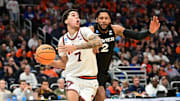 Mar 21, 2025; Milwaukee, WI, USA: Illinois Fighting Illini forward Will Riley (7) drives to the hoop past Xavier Musketeers forward Jerome Hunter (2) during the second half at Fiserv Forum. Mandatory Credit: Benny Sieu-Imagn Images