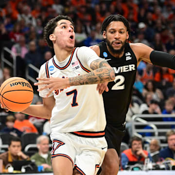 Mar 21, 2025; Milwaukee, WI, USA: Illinois Fighting Illini forward Will Riley (7) drives to the hoop past Xavier Musketeers forward Jerome Hunter (2) during the second half at Fiserv Forum. Mandatory Credit: Benny Sieu-Imagn Images