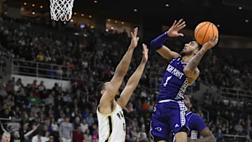 Mar 20, 2025; Providence, RI, USA; High Point Panthers guard Kezza Giffa (1) shoots the ball over Purdue Boilermakers forward Trey Kaufman-Renn (4) during the first half at Amica Mutual Pavilion. Mandatory Credit: Eric Canha-Imagn Images