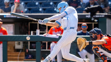 Jun 14, 2024; Omaha, NE, USA; North Carolina Tar Heels center fielder Vance Honeycutt (7) hits a walk off RBI single during the ninth inning against the Virginia Cavaliers at Charles Schwab Filed Omaha. Mandatory Credit: Dylan Widger-USA TODAY Sports
