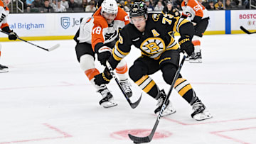Sep 29, 2025; Boston, Massachusetts, USA;  Philadelphia Flyers forward Dennis Gilbert (48) battles Boston Bruins defenseman Charlie McAvoy (73) for the puck during the first period at TD Garden. Mandatory Credit: Eric Canha-Imagn Images