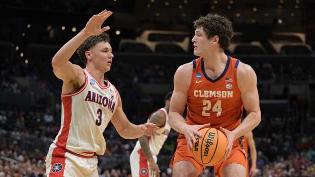 Mar 28, 2024; Los Angeles, CA, USA;  Clemson Tigers center PJ Hall (24) controls the ball against Arizona Wildcats guard Pelle Larsson (3) in the first half in the semifinals of the West Regional of the 2024 NCAA Tournament at Crypto.com Arena. Mandatory Credit: Jayne Kamin-Oncea-USA TODAY Sports