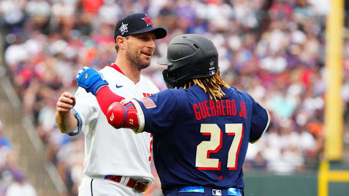 Jul 13, 2021; Denver, Colorado, USA; National League starting pitcher Max Scherzer of the Washington Nationals (31) hugs American League first baseman Vladimir Guerrero Jr. of the Toronto Blue Jays (27) during the first inning of the 2021 MLB All Star Game at Coors Field. Jul 13, 2021; Denver, Colorado, USA; National League starting pitcher Max Scherzer of the Washington Nationals (31) hugs American League first baseman Vladimir Guerrero Jr. of the Toronto Blue Jays (27) during the first inning of the 2021 MLB All Star Game at Coors Field.