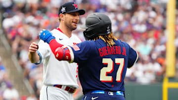Jul 13, 2021: National League starting pitcher Max Scherzer of the Washington Nationals (31) hugs American League first baseman Vladimir Guerrero Jr. of the Toronto Blue Jays (27) during the first inning of the 2021 MLB All Star Game at Coors Field. 
