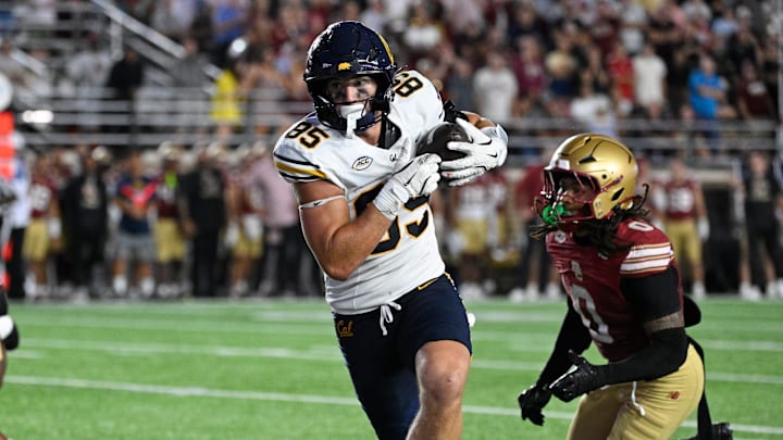 Cal tight end Mason Mini races toward the end zone vs. Boston College Cal tight end Mason Mini races toward the end zone vs. Boston College