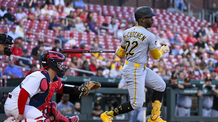Aug 26, 2025; St. Louis, Missouri, USA;  Pittsburgh Pirates designated hitter Andrew McCutchen (22) hits a two run single against the St. Louis Cardinals during the first inning at Busch Stadium. Mandatory Credit: Jeff Curry-Imagn Images