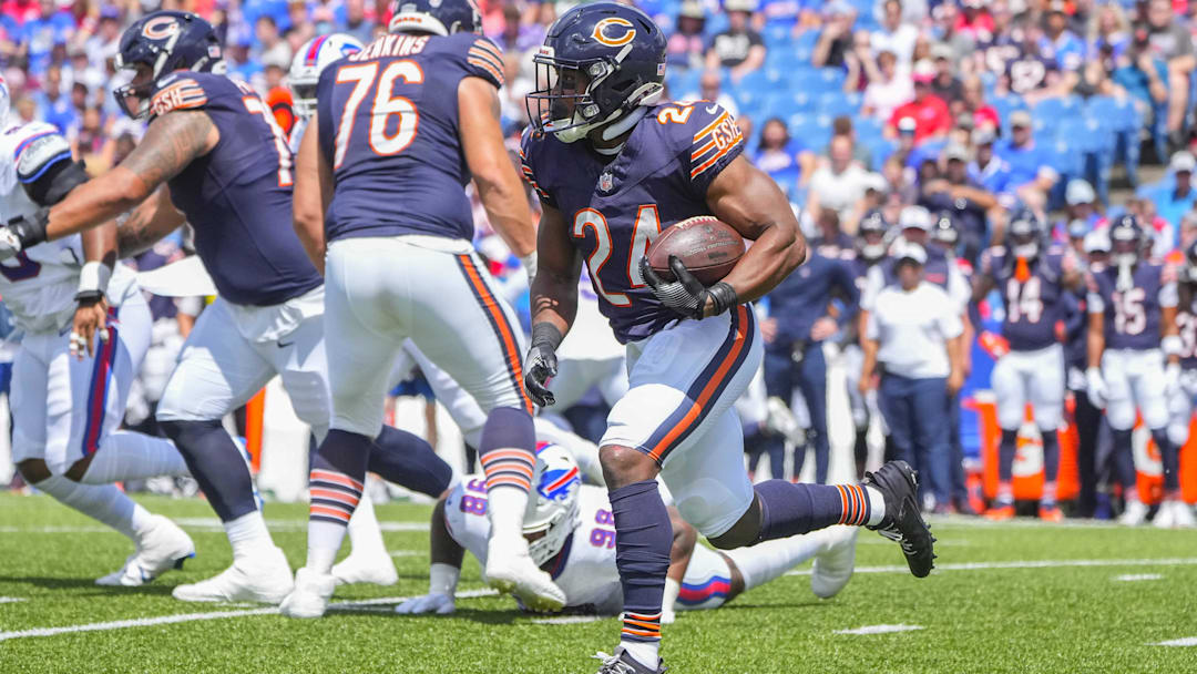Aug 10, 2024; Orchard Park, New York, USA; Chicago Bears running back Khalil Herbert (24) runs with the ball against the Buffalo Bills during the first half at Highmark Stadium. Mandatory Credit: Gregory Fisher-Imagn Images