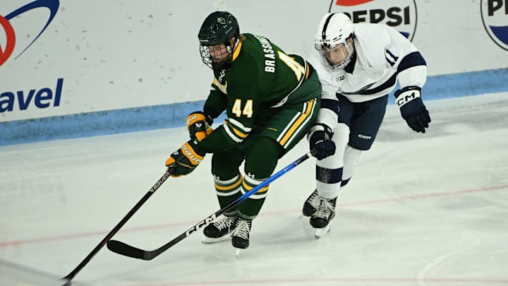 Oct 10, 2025; University Park, PA, USA; Clarkson Golden Knights defenseman Ty Brassington (44) skates past Penn State Nittany Lions forward Luke Misa (11) during the first period at Pegula Ice Arena. Mandatory Credit: Barry Reeger-Imagn Images