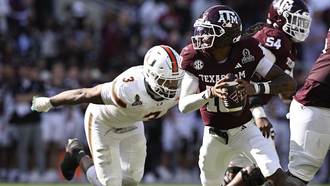 Texas A&M Aggies quarterback Marcel Reed (10) scrambles against Miami Hurricanes defensive lineman Akheem Mesidor (3) Texas A&M Aggies quarterback Marcel Reed (10) scrambles against Miami Hurricanes defensive lineman Akheem Mesidor (3)