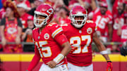 Sep 15, 2024; Kansas City, Missouri, USA; Kansas City Chiefs quarterback Patrick Mahomes (15) and tight end Travis Kelce (87) return to the sidelines after a score against the Cincinnati Bengals during the first half at GEHA Field at Arrowhead Stadium. Mandatory Credit: Denny Medley-Imagn Images