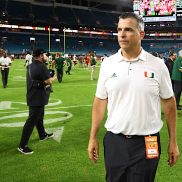 Sep 7, 2024; Miami Gardens, Florida, USA; Miami Hurricanes head coach Mario Cristobal looks on from the field after the game against the Florida A&M Rattlers at Hard Rock Stadium. Mandatory Credit: Sam Navarro-Imagn Images