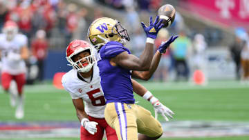 Sep 14, 2024; Seattle, Washington, USA; Washington Huskies wide receiver Giles Jackson (5) catches a pass over Washington State Cougars defensive back Tyson Durant (5) during the second half at Lumen Field.