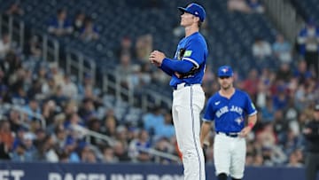 Apr 14, 2025: Toronto Blue Jays starting pitcher Easton Lucas (62) takes a moment on the mound before delivering a pitch against the Atlanta Braves during the fifth inning at Rogers Centre. 