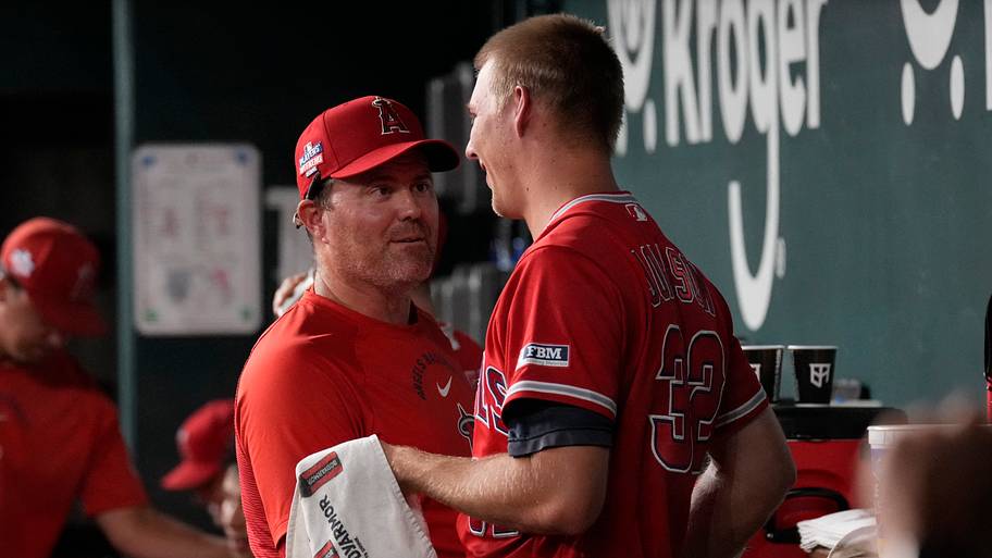 Los Angeles Angels interim pitching coach Tim Leveque talks with pitcher Ryan Johnson