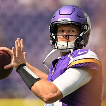 Aug 10, 2024; Minneapolis, Minnesota, USA; Minnesota Vikings quarterback Sam Darnold (14) warms up before the game against the Las Vegas Raiders at U.S. Bank Stadium. Mandatory Credit: Jeffrey Becker-Imagn Images