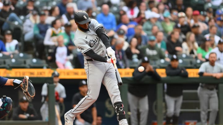 Jun 13, 2024; Seattle, Washington, USA; Chicago White Sox center fielder Luis Robert Jr. (88) hits a home run against the Seattle Mariners during the third inning at T-Mobile Park. Mandatory Credit: Steven Bisig-USA TODAY Sports