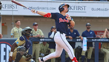 Jun 1, 2025; Oxford, MS, USA; Mississippi Rebels designated hitter Campbell Smithwick (12) hits a home run during the eighth inning against the Georgia Tech Yellowjackets. Mandatory Credit: Petre Thomas-Imagn Images