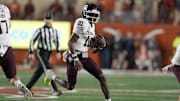 Texas A&M Aggies quarterback Marcel Reed (10) keeps the ball for yards during the first half against the Texas Longhorns at Darrell K Royal-Texas Memorial Stadium. Mandatory Credit: Scott Wachter-Imagn Images