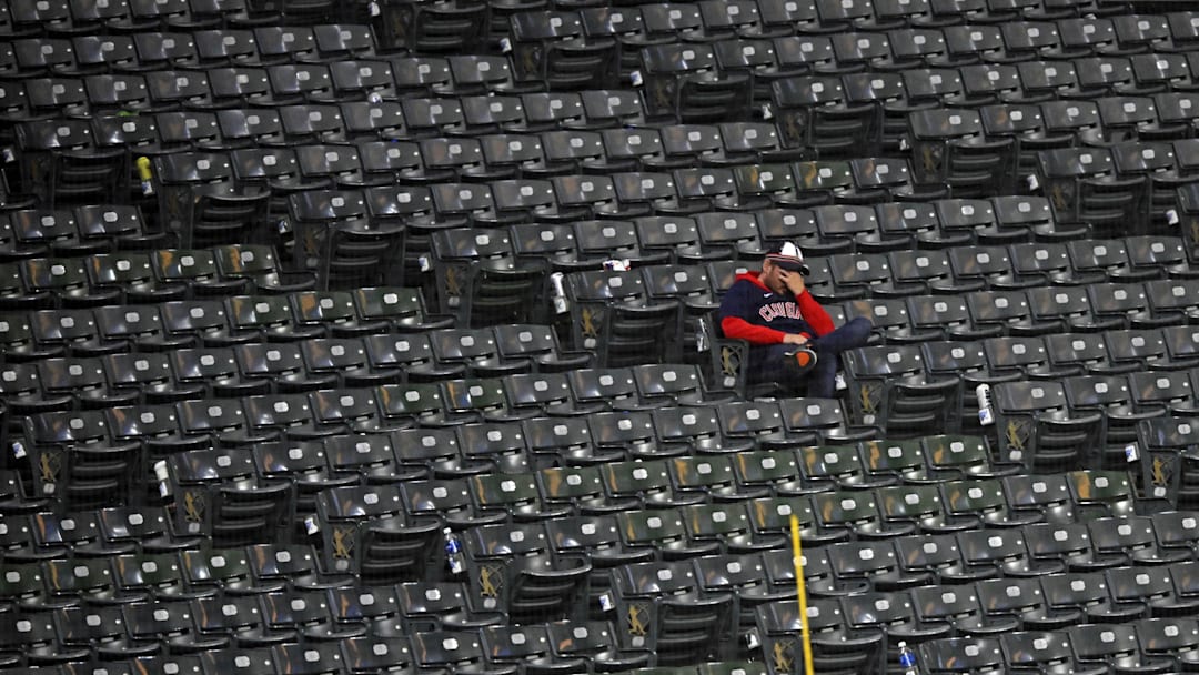 Oct 19, 2024; Cleveland, Ohio, USA; A Cleveland Guardians fan reacts in the stands after the New York Yankees beat the Cleveland Guardians during game five of the ALCS for the 2024 MLB playoffs at Progressive Field. Mandatory Credit: David Richard-Imagn Images