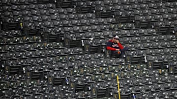 Oct 19, 2024; Cleveland, Ohio, USA; A Cleveland Guardians fan reacts in the stands after the New York Yankees beat the Cleveland Guardians during game five of the ALCS for the 2024 MLB playoffs at Progressive Field. Mandatory Credit: David Richard-Imagn Images