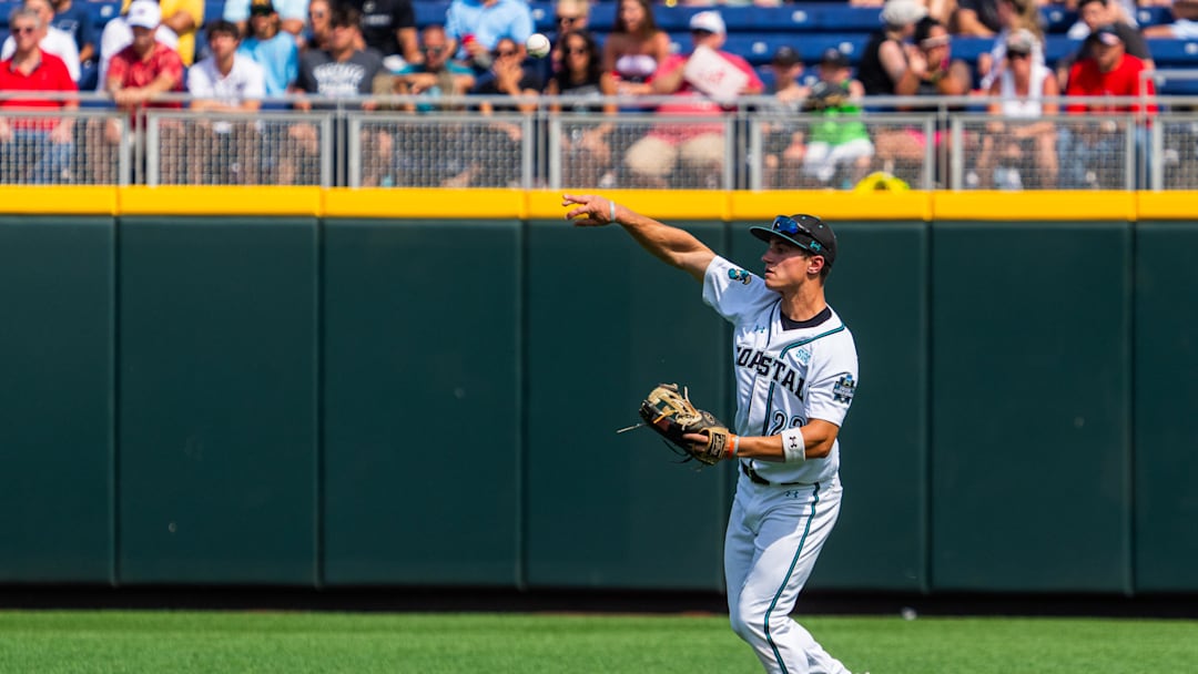 Jun 13, 2025; Omaha, Neb, USA; Coastal Carolina Chanticleers right fielder Blagen Pado (22) throws after getting an out against the Arizona Wildcats during the ninth inning at Charles Schwab Field. Mandatory Credit: Dylan Widger-Imagn Images