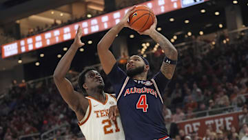 Jan 7, 2025; Austin, Texas, USA; Auburn Tigers forward Johni Broome (4) drives to the basket against Texas Longhorns forward Ze'Rik Onyema (21) during the second half at Moody Center. Mandatory Credit: Scott Wachter-Imagn Images