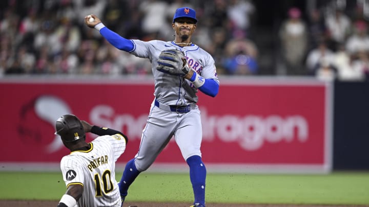 Aug 22, 2024; San Diego, California, USA; New York Mets shortstop Francisco Lindor (12) throws to first base after forcing out San Diego Padres left fielder Jurickson Profar (10) at second base to complete a double play during the fifth inning at Petco Park. Mandatory Credit: Orlando Ramirez-USA TODAY Sports