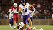 Aug 30, 2024; Stanford, California, USA; TCU Horned Frogs wide receiver Jack Bech (18) runs with the ball past Stanford Cardinal safety Scotty Edwards (21) during the second half at Stanford Stadium. Mandatory Credit: Sergio Estrada-Imagn Images