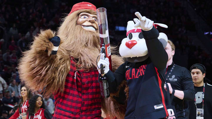 Mar 14, 2023; Portland, Oregon, USA; New Trail Blazers mascot, Douglas Fir, and Blaze give away free t-shirts during a time out in a game between the New York Knicks and Portland Trail Blazers at Moda Center. Mandatory Credit: Troy Wayrynen-USA TODAY Sports