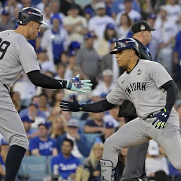 Oct 26, 2024; Los Angeles, California, USA; New York Yankees outfielder Juan Soto (22) celebrates with outfielder Aaron Judge (99) after hitting a solo home run in the third inning against the Los Angeles Dodgers during game two of the 2024 MLB World Series at Dodger Stadium. Mandatory Credit: Jayne Kamin-Oncea-Imagn Images