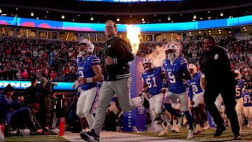 Dec 7, 2024; Charlotte, NC, USA; Southern Methodist Mustangs head coach Rhett Lashlee leads his team to the field before the 2024 ACC Championship game against the Clemson Tigers at Bank of America Stadium. Mandatory Credit: Jim Dedmon-Imagn Images