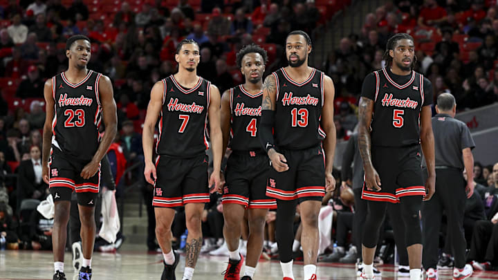 Jan 22, 2025; Houston, Texas, USA; Houston Cougars guard Terrance Arceneaux (23), guard Milos Uzan (7), guard L.J. Cryer (4), forward J'Wan Roberts (13) and forward Ja'Vier Francis (5) walk on the court after a time-out in the second half against the Utah Utes at Fertitta Center. The Cougars defeated the Utes 70-36. Mandatory Credit: Maria Lysaker-Imagn Images 