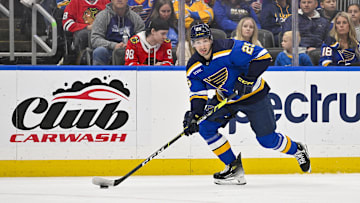 Apr 10, 2024; St. Louis, Missouri, USA;  St. Louis Blues center Jordan Kyrou (25) controls the puck against the Chicago Blackhawks during the second period at Enterprise Center. Mandatory Credit: Jeff Curry-Imagn Images