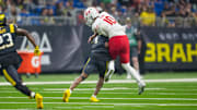 Mar 31, 2024; San Antonio, TX, USA;  San Antonio Brahmas cornerback Bryce Thompson (1) hits DC Defenders quarterback Jordan Ta'amu (10) in the second half at The Alamodome. Mandatory Credit: Daniel Dunn-Imagn Images