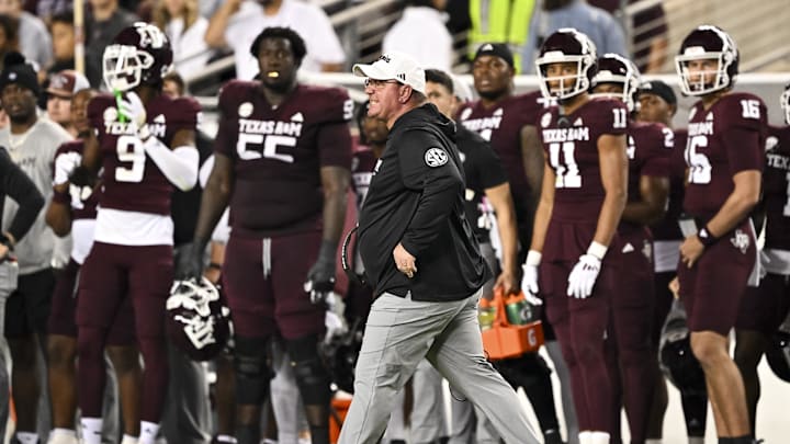 Nov 16, 2024; College Station, Texas, USA; Texas A&M Aggies head coach Mike Elko reacts during the first half against the New Mexico State Aggies at Kyle Field. Mandatory Credit: Maria Lysaker-Imagn Images Nov 16, 2024; College Station, Texas, USA; Texas A&M Aggies head coach Mike Elko reacts during the first half against the New Mexico State Aggies at Kyle Field. Mandatory Credit: Maria Lysaker-Imagn Images