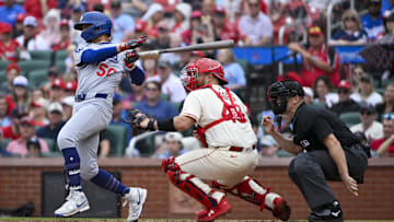 Jun 7, 2025; St. Louis, Missouri, USA;  Los Angeles Dodgers shortstop Mookie Betts (50) hits a single against the St. Louis Cardinals during the ninth inning at Busch Stadium. Mandatory Credit: Jeff Curry-Imagn Images