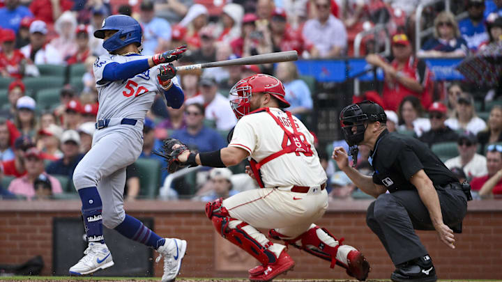Jun 7, 2025; St. Louis, Missouri, USA;  Los Angeles Dodgers shortstop Mookie Betts (50) hits a single against the St. Louis Cardinals during the ninth inning at Busch Stadium. Mandatory Credit: Jeff Curry-Imagn Images