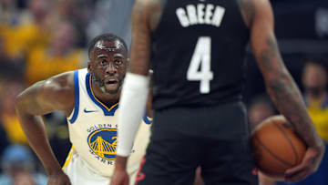 Apr 26, 2025; San Francisco, California, USA; Golden State Warriors forward Draymond Green (left) defends against Houston Rockets guard Jalen Green (4) during the first quarter of game three of first round for the 2024 NBA Playoffs at Chase Center. Mandatory Credit: Darren Yamashita-Imagn Images