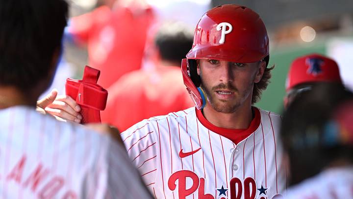 Philadelphia Phillies second baseman Bryson Stott (5) celebrates with his teammates after scoring a run in the first inning of the spring game against the Toronto Blue Jays  at BayCare Ballpark. Mandatory Credit: Jonathan Dyer-Imagn Images